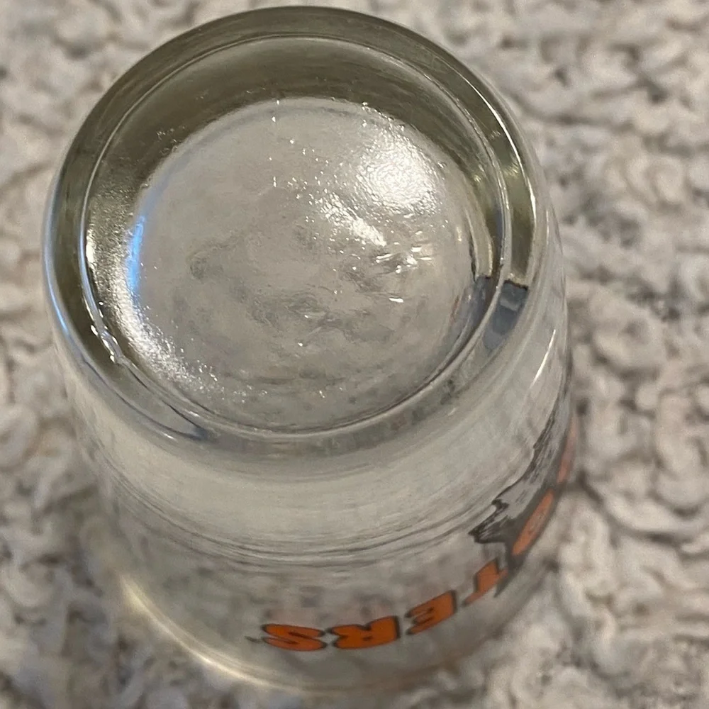 Hooter’s shot glass,  white orange with owl logo, no city specified